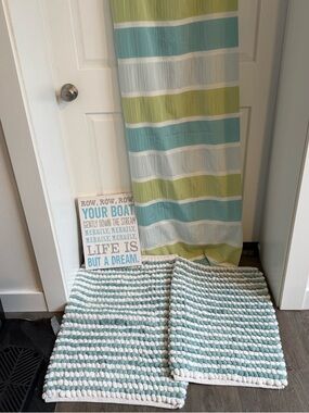 Bathroom decoration bundle: shower curtain, rugs, and wall hanging